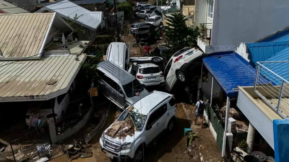 A drone view shows cars piled up after being swept away in floods brought by Typhoon Kalmaegi pile up at a subdivision in Bacayan, Cebu City, Philippines, November 5, 2025. REUTERS/Eloisa Lopez