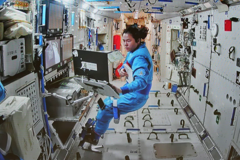 BEIJING, Jan. 21, 2025 -- This screen image captured at Beijing Aerospace Control Center on Jan. 20, 2025 shows Shenzhou-19 astronaut Wang Haoze working inside China's orbiting space station. TO GO WITH "Shenzhou-19 crew completes second series of extravehicular activities",Image: 955766128, License: Rights-managed, Restrictions:, Model Release: no