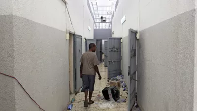 A Libyan walks inside the Abu Salim prison in Tripoli, LIbya, Friday, Aug. 26, 2011, one Libya's most notorious prisons and the scene of a 1996 massacre of prisoners. (AP Photo/Sergey Ponomarev)