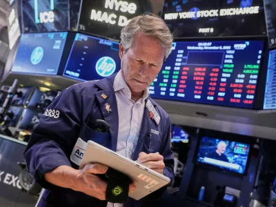 Trader Robert Charmak works on the floor of the New York Stock Exchange, Wednesday, Nov. 5, 2025. (AP Photo/Richard Drew)
