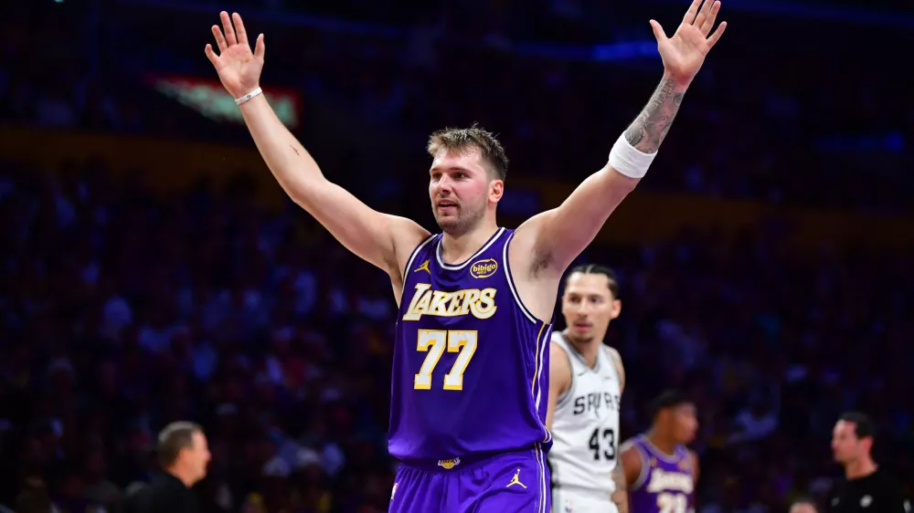Nov 5, 2025; Los Angeles, California, USA; Los Angeles Lakers guard Luka Doncic (77) reacts after scoring a basket against the San Antonio Spurs during the first half at Crypto.com Arena. Mandatory Credit: Gary A. Vasquez-Imagn Images