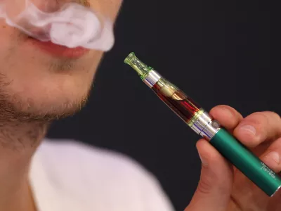 ﻿Martin Borne, co-founder of electronic cigarette retailer "Demain J'arrete", demonstrates the use of an electronic cigarette in his shop in Paris October 8, 2013. The European Parliament voted on Tuesday to water down proposed tobacco legislation, rejecting an immediate ban on menthol cigarettes and scaling down the size of health warnings on packets following intense lobbying by tobacco companies. The parliament also said manufacturers should be free to sell smokeless e-cigarettes, which deliver nicotine electronically and are a rapidly growing market, as a consumer product when not being marketed as an aide to help people quit smoking. REUTERS/Charles Platiau (FRANCE - Tags: SOCIETY HEALTH BUSINESS POLITICS)
