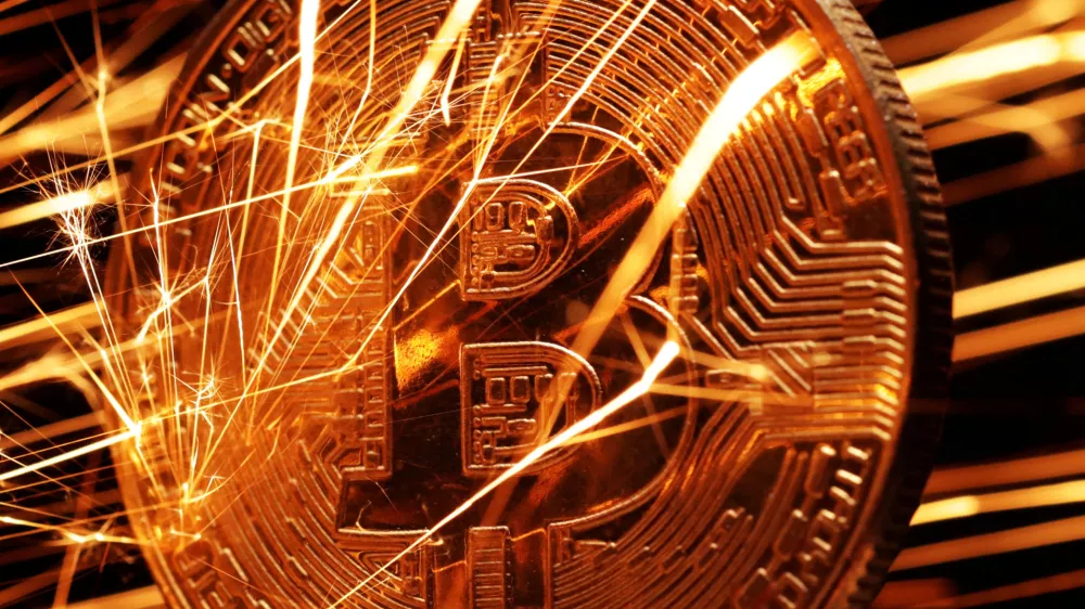 FILE PHOTO: Sparks strike representation of cryptocurrency Bitcoin in this illustration created on November 24, 2024. REUTERS/Dado Ruvic/Illustration/File Photo