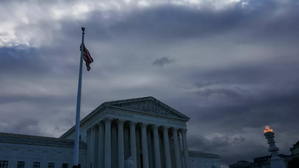 FILE PHOTO: A U.S. Flag flutters outside of the United States Supreme Court Building, in Washington, U.S., December 5, 2024. REUTERS/Evelyn Hockstein/File Photo