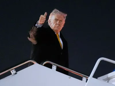 President Donald Trump boards Air Force One on his way to his Mar-a-Lago estate in Palm Beach, Fla., from Joint Base Andrews, Md., Friday, Nov. 7, 2025. (AP Photo/Manuel Balce Ceneta)