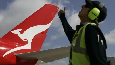 ﻿A worker gives his thumb up to a Qantas Airbus A380 as it arrives at a hangar after it landed at Kingsford Smith International Airport in Sydney September 21, 2008. Qantas took delivery of its first A380 superjumbo on Friday, two years later than planned due to production delays, and Airbus denied it planned another cut in its 2008 delivery forecast from the current 12 aircraft.  REUTERS/Daniel Munoz (AUSTRALIA) - RTX8R5U