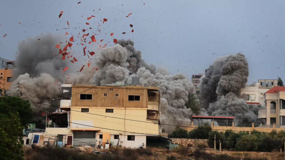 Smoke rises following an Israeli airstrike in the village of Teir Debba, southern Lebanon, Nov. 6, 2025. (AP Photo/Mohammad Zaatari)