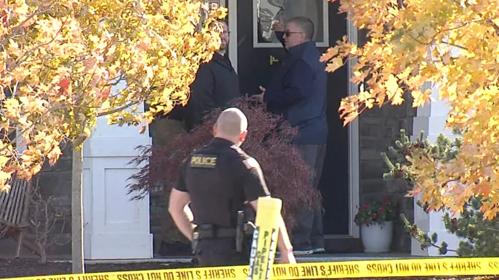CORRECTS LAST NAME - In this image from video provided by WRTV, investigators work at the site of the fatal shooting of house cleaner Maria Florinda Rios Perez who went to the wrong address in Whitestown, Ind., on Wednesday, Nov. 5, 2025. (WRTV via AP)