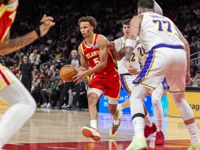 Nov 8, 2025; Atlanta, Georgia, USA; Atlanta Hawks guard Dyson Daniels (5) looks to pass against the Los Angeles Lakers during the second half at State Farm Arena. Mandatory Credit: Dale Zanine-Imagn Images