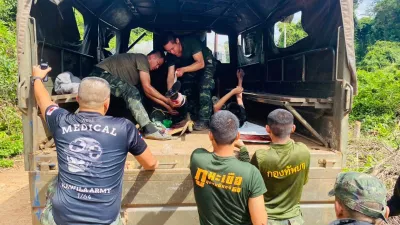 In this photo released by Royal Thai Army, two Thai soldiers injured by a landmine during a patrol near the Thai-Cambodia border are treated as they are to be transferred to a hospital in Sisaket province, Thailand, Monday, Nov. 10, 2025. (Royal Thai Army via AP)