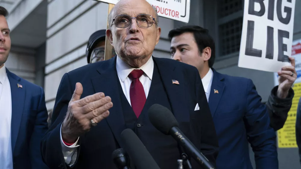 Former New York Mayor Rudy Giuliani speaks during a news conference after his defamation trial outside the federal courthouse in Washington, Friday, Dec. 15, 2023. A jury awarded $148 million in damages on Friday to two former Georgia election workers who sued Rudy Giuliani for defamation over lies he spread about them in 2020 that upended their lives with racist threats and harassment. (AP Photo/Jose Luis Magana)