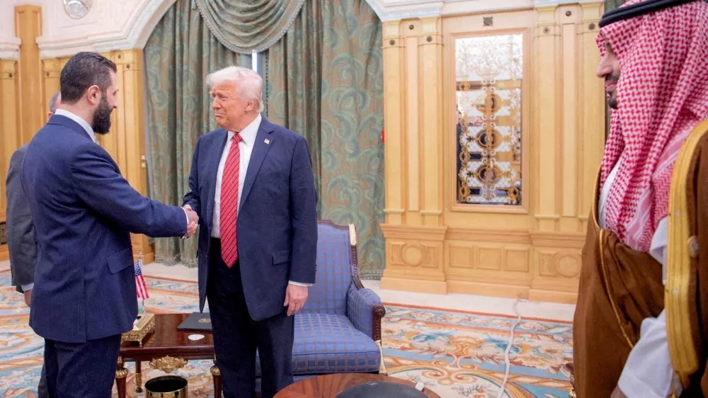 FILE PHOTO: U.S. President Donald Trump meets Syrian President Ahmed al-Sharaa in Riyadh, Saudi Arabia, in this handout released on May 14, 2025. Saudi Press Agency/Handout via REUTERS THIS IMAGE HAS BEEN SUPPLIED BY A THIRD PARTY/File Photo