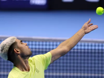 11 November 2025, Italy, Turin: Spanish tennis player Carlos Alcaraz in action against US Taylor Fritz during their men's singles group stage match of the ATP World Tour Finals at the Inalpi Arena. Photo: Felice Calabro/IPA via ZUMA Press/dpa