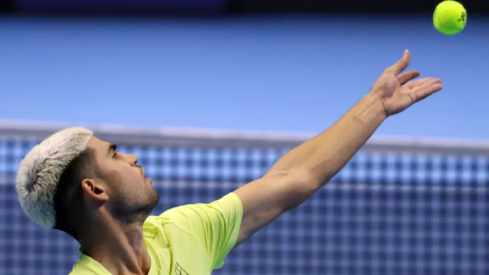 11 November 2025, Italy, Turin: Spanish tennis player Carlos Alcaraz in action against US Taylor Fritz during their men's singles group stage match of the ATP World Tour Finals at the Inalpi Arena. Photo: Felice Calabro/IPA via ZUMA Press/dpa