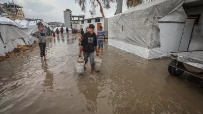GAZA CITY, GAZA - NOVEMBER 14: Palestinians, whose homes were destroyed during Israel's two-year attacks, have hard times trying to evacuate the water after their makeshift tents were flooded with the intense rain at Al Yarmouk Camp in Gaza City, Gaza on November 14, 2025. The onset of cold weather and rainfall has made living conditions even more difficult for residents living in makeshift tents. Hamza Z. H. Qraiqea / AnadoluNo Use USA No use UK No use Canada No use France No use Japan No use Italy No use Australia No use Spain No use Belgium No use Korea No use South Africa No use Hong Kong No use New Zealand No use Turkey