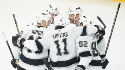 Los Angeles Kings' Joel Edmundson (6) celebrates his goal over Montreal Canadiens with teammates Brandt Clarke (92), Anze Kopitar (11), Joel Armia (40) and Adrian Kempe (9) during second period NHL hockey action in Montreal on Tuesday, Nov. 11, 2025. (Christinne Muschi/The Canadian Press via AP)