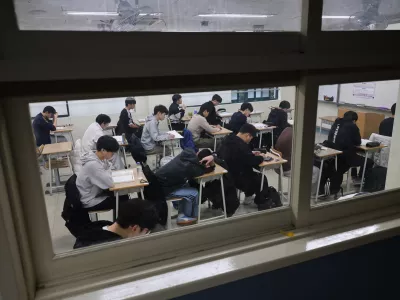 Students wait for the start of the annual college entrance examinations at an exam hall in Seoul, South Korea, Thursday, Nov. 13, 2025. (Kim Hong-Ji/Pool Photo via AP)