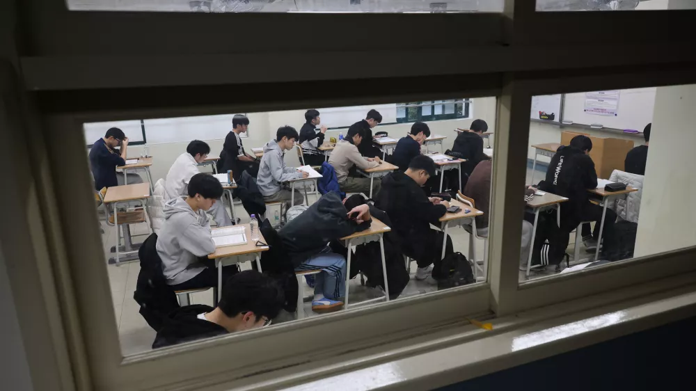 Students wait for the start of the annual college entrance examinations at an exam hall in Seoul, South Korea, Thursday, Nov. 13, 2025. (Kim Hong-Ji/Pool Photo via AP)