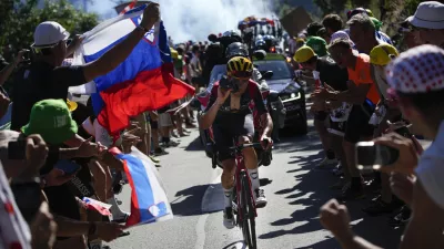 Stage winner Britain's Thomas Pidcock climbs Alpe D'Huez during the twelfth stage of the Tour de France cycling race over 165.5 kilometers (102.8 miles) with start in Briancon and finish in Alpe d'Huez, France, Thursday, July 14, 2022. (AP Photo/Daniel Cole)