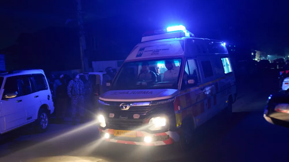 An ambulance leaves the site of an explosion inside a police station in Srinagar, Indian controlled Kashmir, Friday, Nov. 14, 2025. (AP Photo/Yasin Dar)