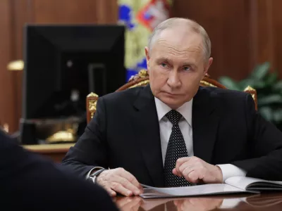 Russian President Vladimir Putin listens to Astrakhan Region Governor Igor Babushkin at the Kremlin in Moscow, Russia, Thursday, Nov. 13, 2025. (Gavriil Grigorov/Sputnik, Kremlin Pool Photo via AP)