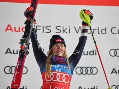 United States' Mikaela Shiffrin celebrates on the podium after winning an alpine ski, women's World Cup slalom, in Levi, Finland, Saturday, Nov. 15, 2025. (AP Photo/Marco Trovati)
