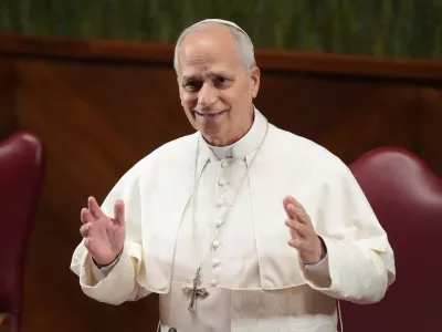 Pope Leo XIV gestures as he arrives at the Pontifical Lateran University on the occasion of the opening of the academic year, in Rome, Friday, Nov. 14, 2025. (AP Photo/Alessandra Tarantino)
