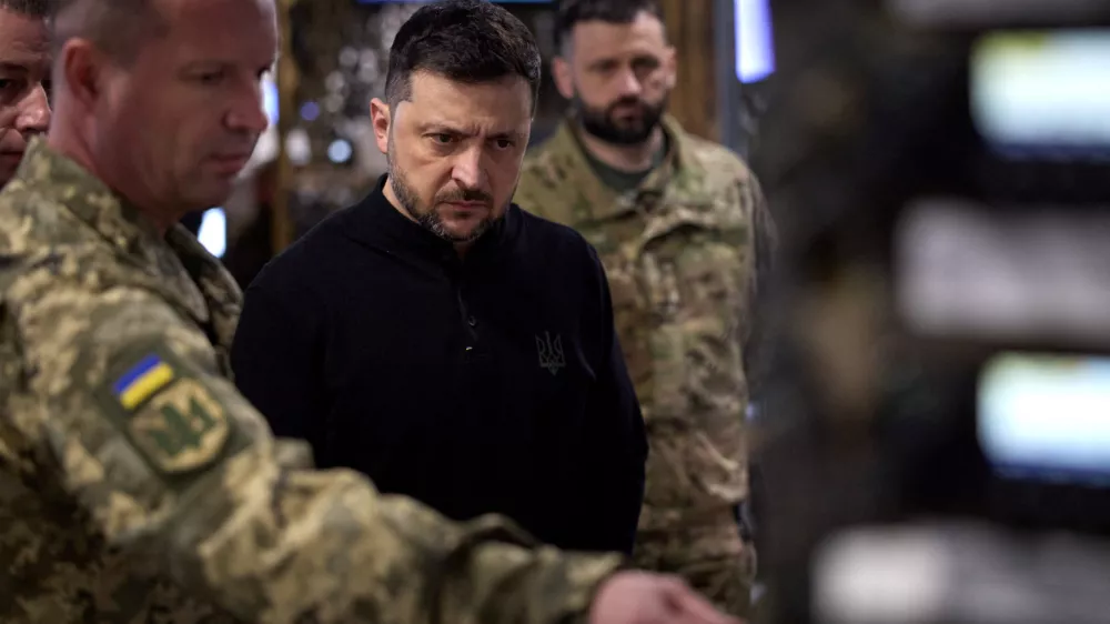 Ukraine's President Volodymyr Zelenskiy listens to a report of senior officers while he visits a command position of the 128th Zakarpattia Separate Mountain Assault Brigade at a front line, amid Russia's attack on Ukraine, in Zaporizhzhia region, Ukraine November 13, 2025. Ukrainian Presidential Press Service/Handout via REUTERS  THIS IMAGE HAS BEEN SUPPLIED BY A THIRD PARTY