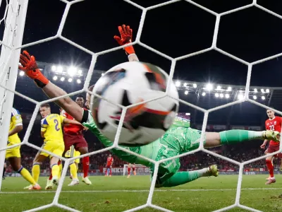 Soccer Football - FIFA World Cup - UEFA Qualifiers - Group B - Switzerland v Sweden - Stade de Geneve, Geneva, Switzerland - November 15, 2025 Switzerland's Breel Embolo scores their first goal as Sweden's Viktor Johansson attempts to make a save REUTERS/Stefan Wermuth
