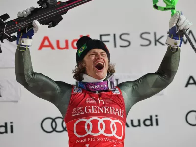 Brazil's Lucas Pinheiro Braathen celebrates on the podium winning an alpine ski, men's World Cup slalom, in Levi, Finland, Sunday, Nov. 16, 2025. (AP Photo/Marco Trovati)
