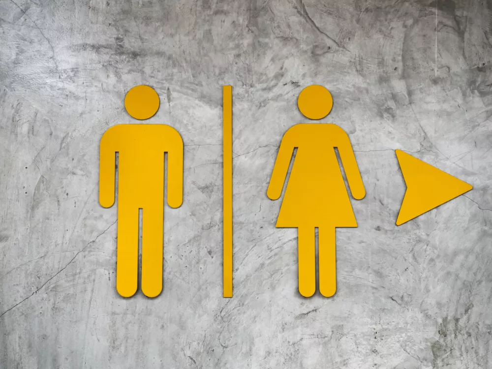 ﻿Male and Female Restroom sign on Polished wall