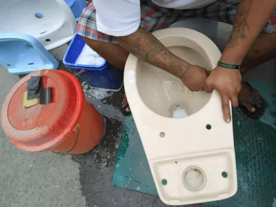 ﻿A worker cleans a recycled toilet bowl before putting for sale at 1,500 pesos () each along a major street in Manila November 19, 2014. The United Nations General Assembly has declared November 19 as World Toilet Day to raise awareness about the need for all human beings to have access to sanitation. REUTERS/Romeo Ranoco (PHILIPPINES - Tags: SOCIETY)
