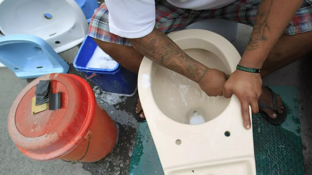 ﻿A worker cleans a recycled toilet bowl before putting for sale at 1,500 pesos ($34) each along a major street in Manila November 19, 2014. The United Nations General Assembly has declared November 19 as World Toilet Day to raise awareness about the need for all human beings to have access to sanitation. REUTERS/Romeo Ranoco (PHILIPPINES - Tags: SOCIETY)