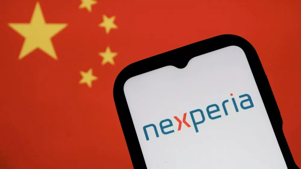 In this photo illustration, a Nexperia logo is displayed on a smartphone with a Chinese flag in the background.,Image: 1050002666, License: Rights-managed, Restrictions: *** World Rights *** Strictly for editorial news purposes only ***, Model Release: no