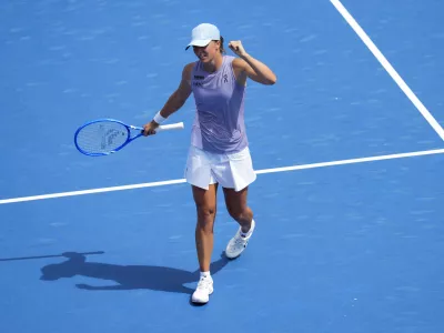 Aug 17, 2025; Cincinnati, OH, USA; Iga Swiatek (POL) reacts to defeating Elena Rybakina (KAZ) during the Cincinnati Open at the Lindner Family Tennis Center. Mandatory Credit: Aaron Doster-Imagn Images