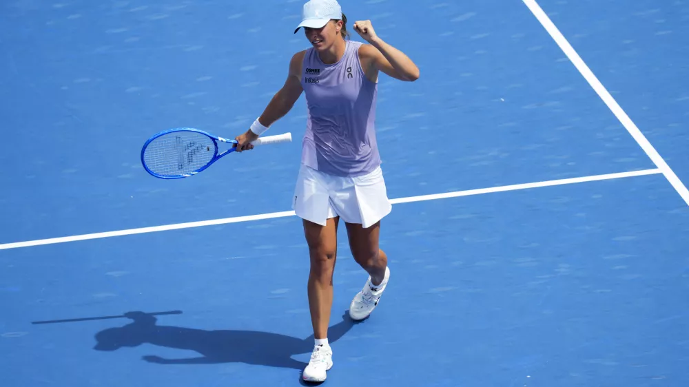 Aug 17, 2025; Cincinnati, OH, USA; Iga Swiatek (POL) reacts to defeating Elena Rybakina (KAZ) during the Cincinnati Open at the Lindner Family Tennis Center. Mandatory Credit: Aaron Doster-Imagn Images