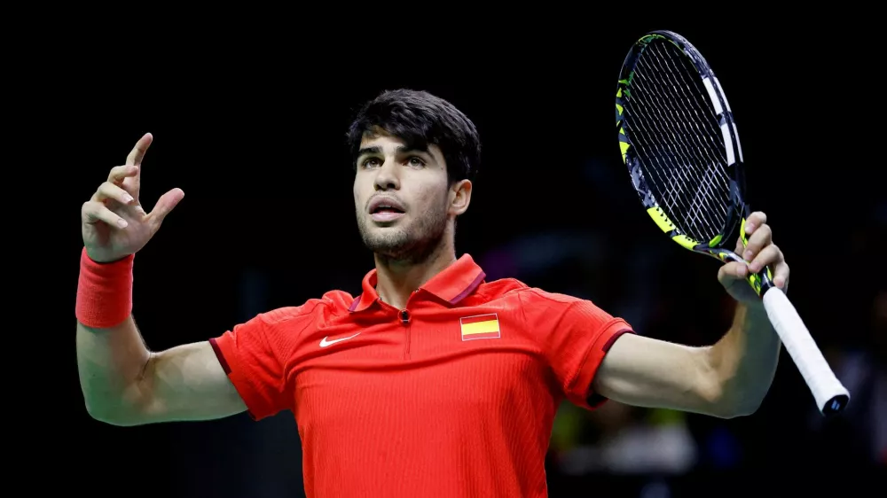 FILE PHOTO: Tennis - Davis Cup Finals - Quarter Final - Netherlands v Spain - Palacio de Deportes Jose Maria Martin Carpena Arena, Malaga, Spain - November 19, 2024 Spain's Carlos Alcaraz reacts during their match against Netherlands' Botic van de Zandschulp and Wesley Koolhof REUTERS/Juan Medina/File Photo