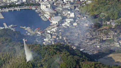 Smoke rises from the site where a massive fire blazed through more than 170 buildings, as seen from a helicopter, in Oita, Oita Prefecture, southwestern Japan, November 19, 2025, in this photo taken by Kyodo. Mandatory credit Kyodo/via REUTERS ATTENTION EDITORS - THIS IMAGE HAS BEEN SUPPLIED BY A THIRD PARTY. MANDATORY CREDIT. JAPAN OUT. NO COMMERCIAL OR EDITORIAL SALES IN JAPAN.   TPX IMAGES OF THE DAY