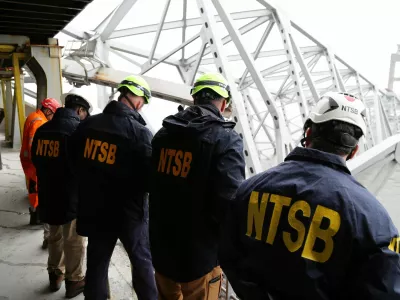National Transportation Safety Board (NTSB) investigators work on the cargo vessel Dali, which struck and collapsed the Francis Scott Key Bridge, in Baltimore, Maryland, U.S. March 27, 2024. Peter Knudson/NTSB/Handout via REUTERS  THIS IMAGE HAS BEEN SUPPLIED BY A THIRD PARTY