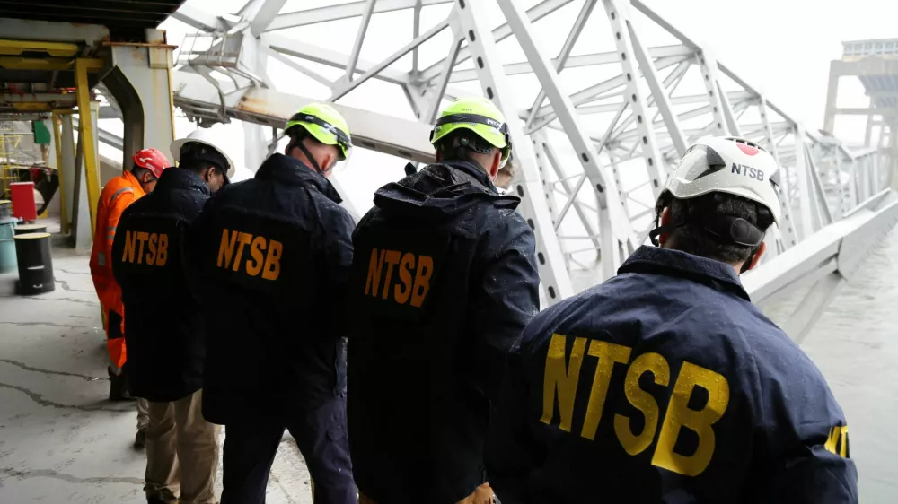 National Transportation Safety Board (NTSB) investigators work on the cargo vessel Dali, which struck and collapsed the Francis Scott Key Bridge, in Baltimore, Maryland, U.S. March 27, 2024. Peter Knudson/NTSB/Handout via REUTERS  THIS IMAGE HAS BEEN SUPPLIED BY A THIRD PARTY