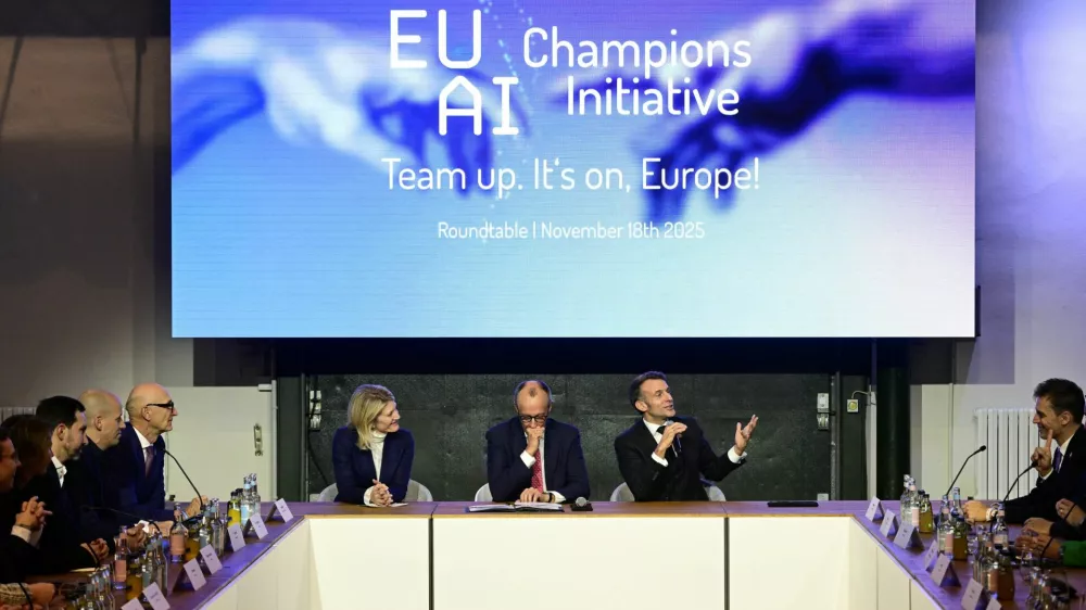 France's President Emmanuel Macron addresses investors next to German chancellor Friedrich Merz and Managing director and Head of Europe at General Catalyst Jeannette zu Fürstenberg at the EU AI Champions Initiative at a summit on Europe's technological sovereignty, in the EUREF Campus in Berlin, Germany, November 18, 2025. JOHN MACDOUGALL/Pool via REUTERS