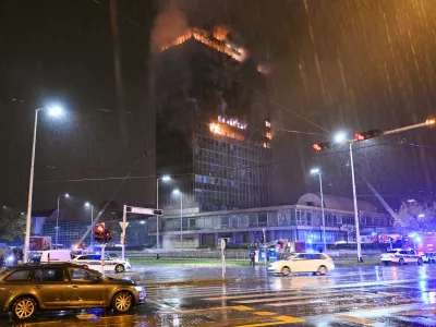 Firefighters work to extinguish the fire that caught 'Vjesnik' skyscraper, which used to accommodate most of Croatian media companies, in Zagreb, Croatia, early Tuesday, Nov. 18, 2025. (AP Photo/Damir Krajac)