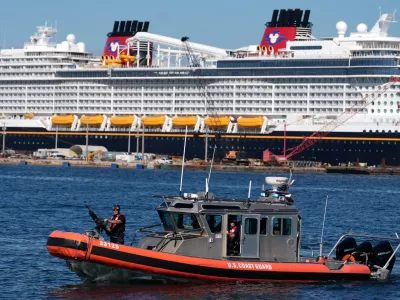 A U.S. Coast Guard boat patrols in front of a cruise ship during a media event showcasing cocaine seizures, Wednesday, Nov. 19, 2025, at Port Everglades in Fort Lauderdale, Fla. (AP Photo/Rebecca Blackwell)
