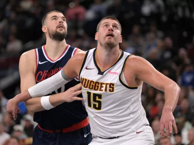 Apr 26, 2025; Inglewood, California, USA; Denver Nuggets center Nikola Jokic (15) and Los Angeles Clippers center Ivica Zubac (40) looks for a rebound in the second half of game four of round one of the 2024 NBA Playoffs at Intuit Dome. Mandatory Credit: Jayne Kamin-Oncea-Imagn Images