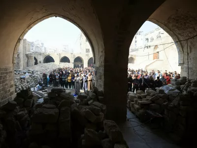 Palestinians perform Friday prayers at the Omari Mosque, which was damaged by Israeli shelling during the war, in Gaza City November 21, 2025. REUTERS/Dawoud Abu Alkas