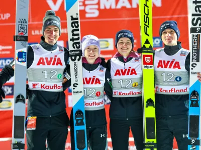 Slovenia celebrates their second place in the mixed team competition during the World Cup ski jumping in the large Lysgårdsbakken in Lillehammer, Norway, Friday Nov. 21, 2025. (Geir Olsen/NTB via AP)