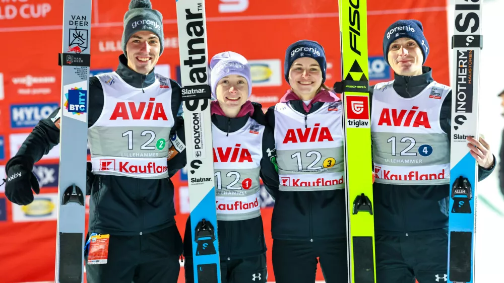 Slovenia celebrates their second place in the mixed team competition during the World Cup ski jumping in the large Lysgårdsbakken in Lillehammer, Norway, Friday Nov. 21, 2025. (Geir Olsen/NTB via AP)