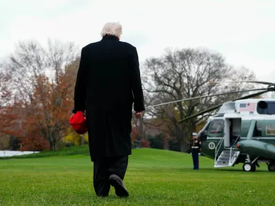 U.S. President Donald Trump walks to board Marine One to depart for Joint Base Andrews, from the South Lawn at the White House in Washington, D.C., U.S., November 22, 2025. REUTERS/Aaron Schwartz