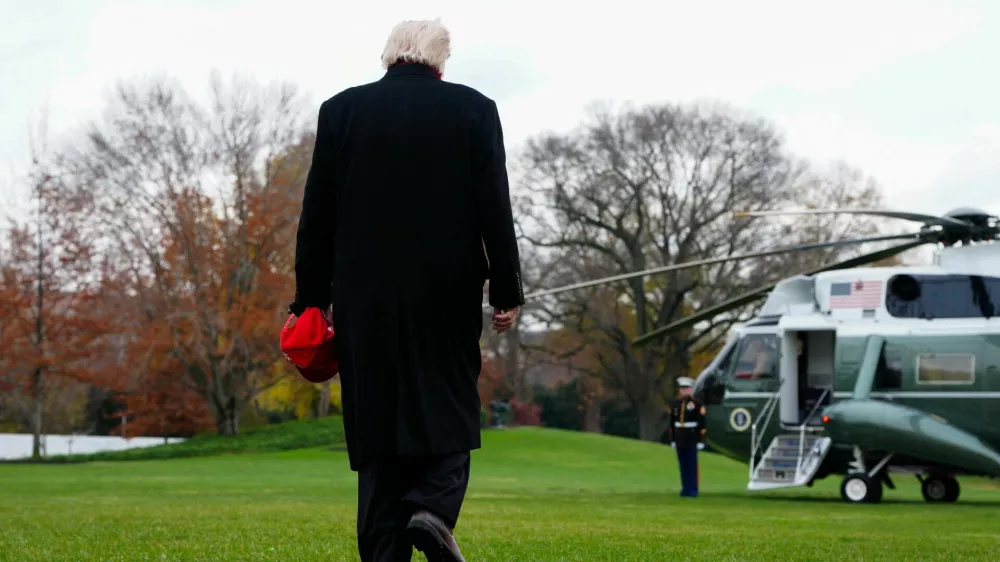 U.S. President Donald Trump walks to board Marine One to depart for Joint Base Andrews, from the South Lawn at the White House in Washington, D.C., U.S., November 22, 2025. REUTERS/Aaron Schwartz
