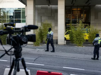 Diplomatic security officers secure the entrance of the InterContinental hotel as U.S. and Ukrainian officials prepare for closed-door talks on ending Russia's war in Ukraine, with the exact time and location undisclosed, in Geneva, Switzerland, November 23, 2025. REUTERS/Pierre Albouy TPX IMAGES OF THE DAY